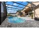 Stunning screened-in pool with brick pavers and plenty of room for lounging by the beautiful blue pool at 1008 Soldier Creek Ct, Oviedo, FL 32765