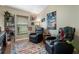 Cozy room with two leather recliners, window, rug, and Star Wars themed wall art at 1008 Soldier Creek Ct, Oviedo, FL 32765
