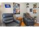 Comfortable room with two leather recliners and Star Wars themed wall art at 1008 Soldier Creek Ct, Oviedo, FL 32765