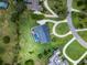 Aerial view of home showing property lines with inground pool and circular drive at 104 Amberwood Ct, Longwood, FL 32779