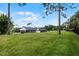 Lush, expansive backyard providing privacy and ample space, complemented by the home's well-maintained exterior at 104 Amberwood Ct, Longwood, FL 32779