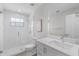 Bright and clean bathroom with glass enclosed shower and a white marble topped vanity at 104 Amberwood Ct, Longwood, FL 32779