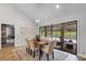 Bright dining area with a view of the pool, adjacent to the kitchen at 104 Amberwood Ct, Longwood, FL 32779
