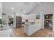 Open kitchen featuring stainless steel appliances and an island with breakfast bar seating at 104 Amberwood Ct, Longwood, FL 32779