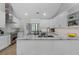 Spacious kitchen featuring stainless steel appliances, white cabinetry, and marble countertops at 104 Amberwood Ct, Longwood, FL 32779