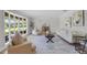Bright and airy living room featuring a large window, stylish decor and wood-look flooring at 104 Amberwood Ct, Longwood, FL 32779