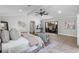 Bright main bedroom with vaulted ceilings, ceiling fan, sliding doors to patio, and sitting area at 104 Amberwood Ct, Longwood, FL 32779