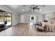 Bright main bedroom with vaulted ceilings, sliding doors to patio and pool, and sitting area at 104 Amberwood Ct, Longwood, FL 32779