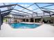 Enclosed pool area featuring brick trim, an expansive patio, and easy access to the home at 104 Amberwood Ct, Longwood, FL 32779