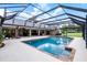 Enclosed pool area featuring brick trim, an expansive patio, and outdoor seating area at 104 Amberwood Ct, Longwood, FL 32779