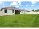 A lovely green backyard shows a well-maintained lawn and a white fence at 1091 Wood Dale Cir, Oviedo, FL 32765