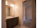 Stylish bathroom features a double vanity and marble floors, leading to additional rooms at 1091 Wood Dale Cir, Oviedo, FL 32765