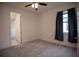 Bright bedroom with carpet, a ceiling fan, and a window with blue curtains at 1091 Wood Dale Cir, Oviedo, FL 32765
