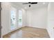 Sunlit bedroom featuring tile floors, recessed lighting, and access to a private balcony at 1091 Wood Dale Cir, Oviedo, FL 32765