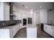Modern kitchen featuring sleek cabinets, stainless steel appliances, and an island at 1091 Wood Dale Cir, Oviedo, FL 32765