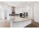Spacious modern kitchen with white cabinets, a large center island, and stainless steel appliances at 1091 Wood Dale Cir, Oviedo, FL 32765