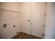 Laundry room with a wire shelf, a door, and wood-look tile flooring at 1091 Wood Dale Cir, Oviedo, FL 32765