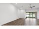Spacious living room featuring sliding glass doors and wood floors at 1091 Wood Dale Cir, Oviedo, FL 32765
