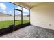 Screened patio shows a view of the yard and a dog door in the screen at 1091 Wood Dale Cir, Oviedo, FL 32765