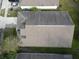 Aerial view of a single-Gathering home with a large backyard and neighboring properties in a residential area at 11236 Rouse Run Cir, Orlando, FL 32817