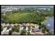 Aerial view of the community featuring mature trees, ponds and well maintained homes at 11236 Rouse Run Cir, Orlando, FL 32817