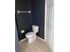 Toilet room features neutral tiled floors and dark blue walls at 11236 Rouse Run Cir, Orlando, FL 32817
