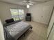 Neutral bedroom with tile floors, ceiling fan, and a window for ample natural light at 11236 Rouse Run Cir, Orlando, FL 32817