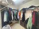 Large walk-in closet featuring ample storage space with shelving and hanging racks for organization at 11236 Rouse Run Cir, Orlando, FL 32817