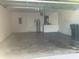 Spacious garage with ample room for parking and storage, equipped with water heater at 11236 Rouse Run Cir, Orlando, FL 32817