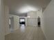 Spacious living room with ceramic tile floors and lots of natural light shining through a large window at 11236 Rouse Run Cir, Orlando, FL 32817