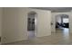 Open-concept living area with tile flooring, showcasing archways to the kitchen and other living spaces at 11236 Rouse Run Cir, Orlando, FL 32817