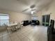 The living room has modern furnishings and tile flooring at 11236 Rouse Run Cir, Orlando, FL 32817