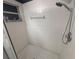 Shower stall with tile surround and modern showerhead, ready for a refreshing and relaxing experience at 11236 Rouse Run Cir, Orlando, FL 32817