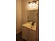 Bathroom sink and vanity with modern fixtures and tiled backsplash at 11588 Westwood Blvd # 1523, Orlando, FL 32821