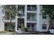 A view of the exterior of the condo building featuring stairwells and balconies at 11588 Westwood Blvd # 1523, Orlando, FL 32821