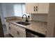 The kitchen features white cabinets, granite countertops, and stainless steel appliances at 11588 Westwood Blvd # 1523, Orlando, FL 32821
