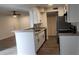 Open kitchen view showcasing granite counters, stainless appliances, and seamlessly connecting to the living area at 11588 Westwood Blvd # 1523, Orlando, FL 32821