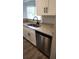 The kitchen features granite countertops, stainless steel appliances, and white cabinets with black hardware at 11588 Westwood Blvd # 1523, Orlando, FL 32821
