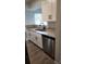 The kitchen features granite countertops, stainless steel appliances, and white cabinets with black hardware at 11588 Westwood Blvd # 1523, Orlando, FL 32821