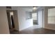 Open concept living room adjacent to kitchen with updated flooring and plenty of light at 11588 Westwood Blvd # 1523, Orlando, FL 32821
