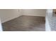 Open concept living room with updated flooring and white trim at 11588 Westwood Blvd # 1523, Orlando, FL 32821