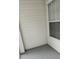 Exterior of a screened-in porch area with vinyl siding and a window at 11588 Westwood Blvd # 1523, Orlando, FL 32821