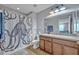 Bathroom featuring a unique octopus shower curtain, vanity with granite countertop, and tile floors at 11616 Thacker Dr, Clermont, FL 34711