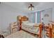 Cozy bedroom with a bed, vanity area, and a playful rug adding a pop of color at 11616 Thacker Dr, Clermont, FL 34711