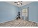 Bedroom with hardwood-style floors and a bar area on display at 11616 Thacker Dr, Clermont, FL 34711