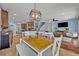 Dining area, which is open to the kitchen, has plenty of light from backyard-facing windows at 11616 Thacker Dr, Clermont, FL 34711