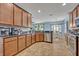 Eat-in kitchen with stainless steel appliances, a breakfast nook with a view of the backyard at 11616 Thacker Dr, Clermont, FL 34711