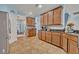 Spacious kitchen featuring granite countertops, stainless steel appliances, and light blue walls at 11616 Thacker Dr, Clermont, FL 34711