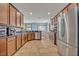 A kitchen with stainless steel appliances, granite countertops and breakfast nook in the background at 11616 Thacker Dr, Clermont, FL 34711