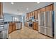 An open concept kitchen with stainless steel appliances and a breakfast bar area at 11616 Thacker Dr, Clermont, FL 34711
